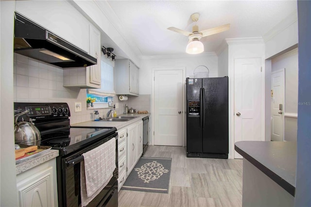 kitchen featuring black appliances, under cabinet range hood, ornamental molding, a sink, and a ceiling fan
