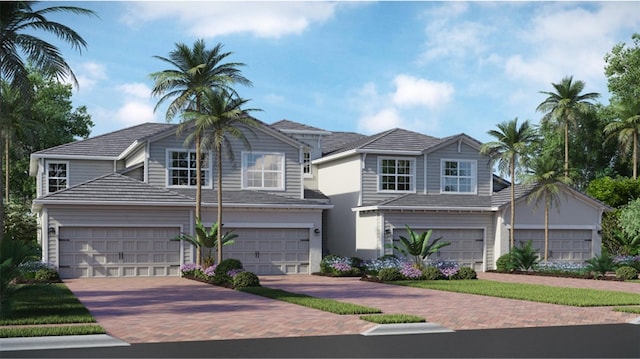 17725 Boracay Ct Unit 17-102, Venice, FL 34293 - traditional-style house featuring decorative driveway and an attached garage