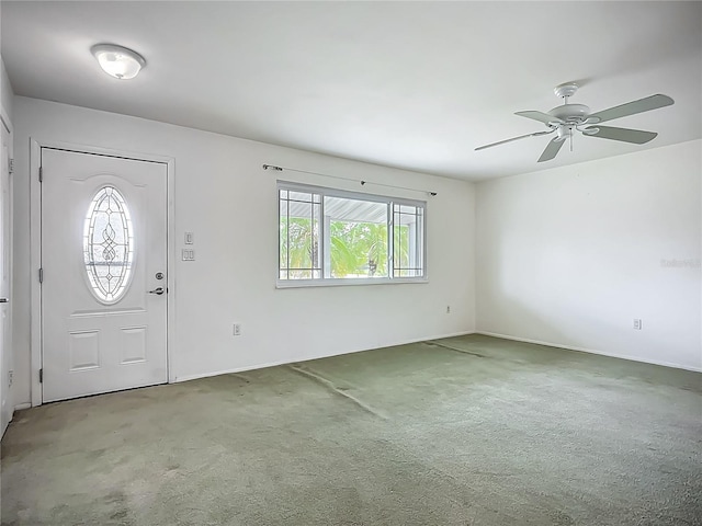 904 Desert Hills Dr, Sun City Center, FL 33573 - carpeted foyer featuring ceiling fan and baseboards