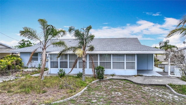 904 Desert Hills Dr, Sun City Center, FL 33573 - back of house featuring a sunroom, a patio, and a shingled roof
