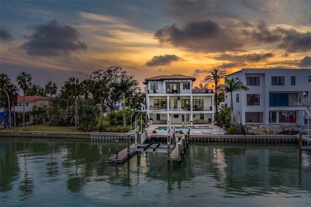 15805 Redington Dr, Redington Beach, FL 33708 - dock featuring boat lift, a water view, and a balcony