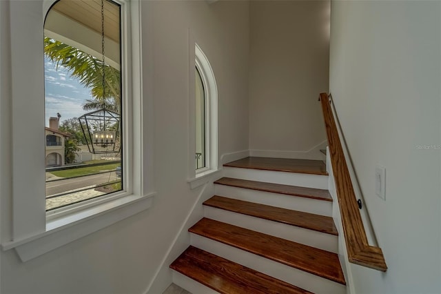 15805 Redington Dr, Redington Beach, FL 33708 - staircase with a chandelier