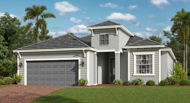 view of front of home with a garage, a front yard, decorative driveway, and stucco siding