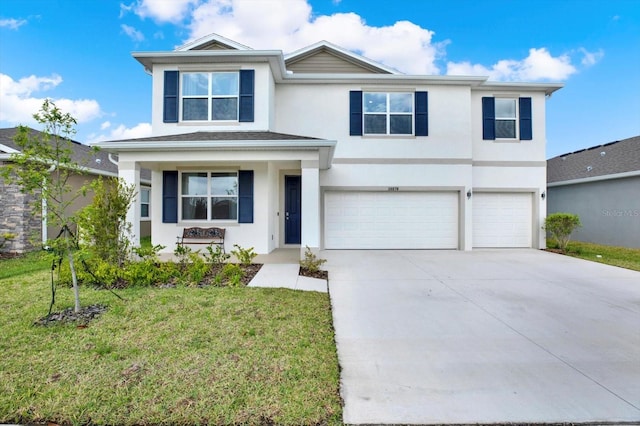 10379 Bridgegate Heights Loop, San Antonio, FL 33576 - view of front of property with stucco siding, an attached garage, a front yard, and concrete driveway