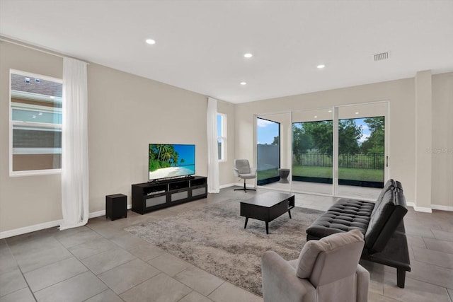 10379 Bridgegate Heights Loop, San Antonio, FL 33576 - living room featuring recessed lighting, baseboards, and tile patterned flooring