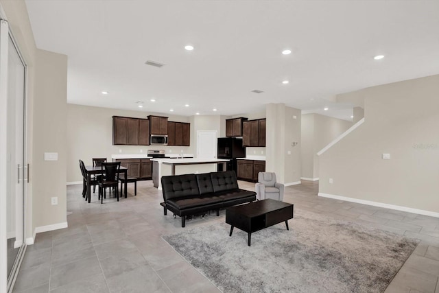10379 Bridgegate Heights Loop, San Antonio, FL 33576 - living room with recessed lighting and baseboards