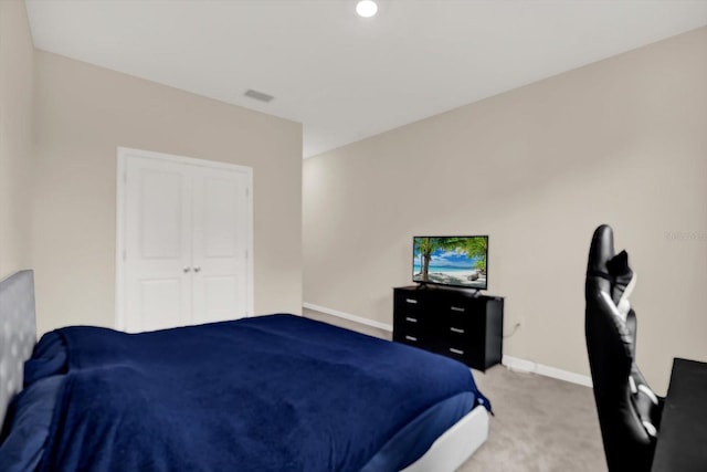 10379 Bridgegate Heights Loop, San Antonio, FL 33576 - bedroom with light carpet, baseboards, and a closet