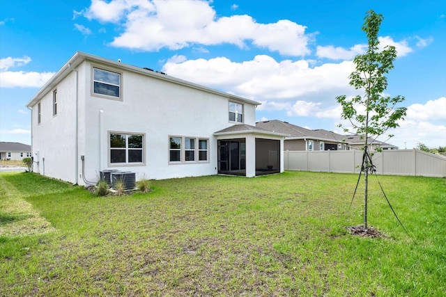 10379 Bridgegate Heights Loop, San Antonio, FL 33576 - rear view of house featuring a sunroom and stucco siding