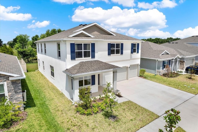 10379 Bridgegate Heights Loop, San Antonio, FL 33576 - traditional-style home featuring a garage, concrete driveway, stucco siding, and a front yard