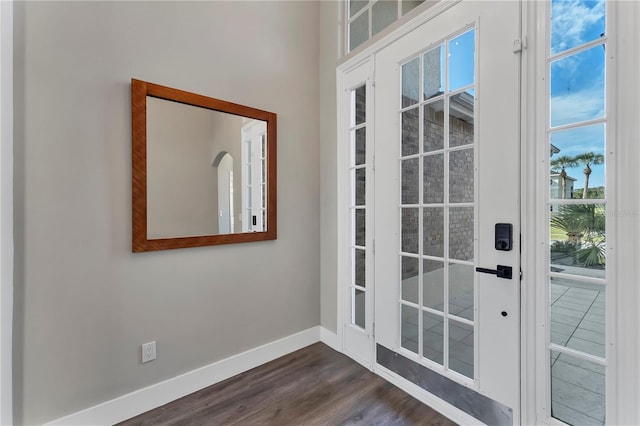 1530 The Oaks Blvd, Kissimmee, FL 34746 - doorway to outside with dark wood-style flooring and baseboards