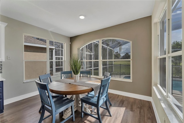 1530 The Oaks Blvd, Kissimmee, FL 34746 - dining space with dark wood-type flooring and baseboards
