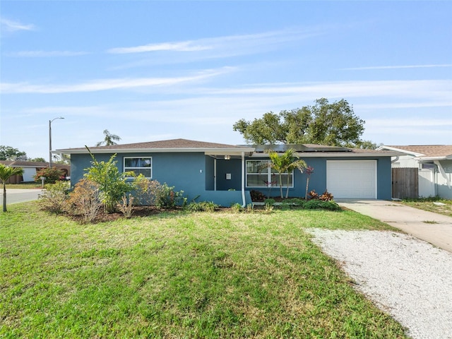 4238 Glissade Dr, New Port Richey, FL 34652 - ranch-style home with stucco siding, driveway, solar panels, and an attached garage