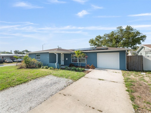4238 Glissade Dr, New Port Richey, FL 34652 - single story home featuring a garage, stucco siding, solar panels, and concrete driveway
