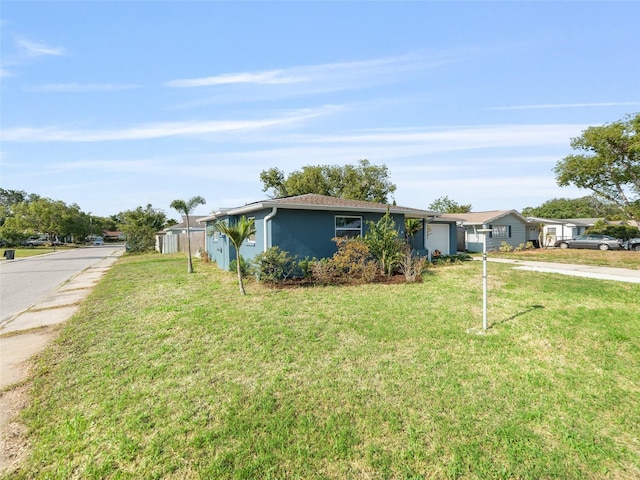 4238 Glissade Dr, New Port Richey, FL 34652 - ranch-style home featuring a garage, driveway, a front yard, and stucco siding