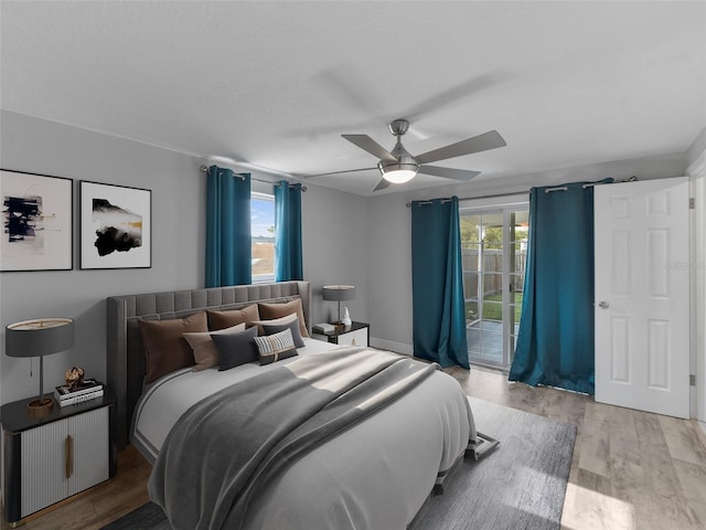 4238 Glissade Dr, New Port Richey, FL 34652 - bedroom with access to exterior, wood finished floors, and ceiling fan