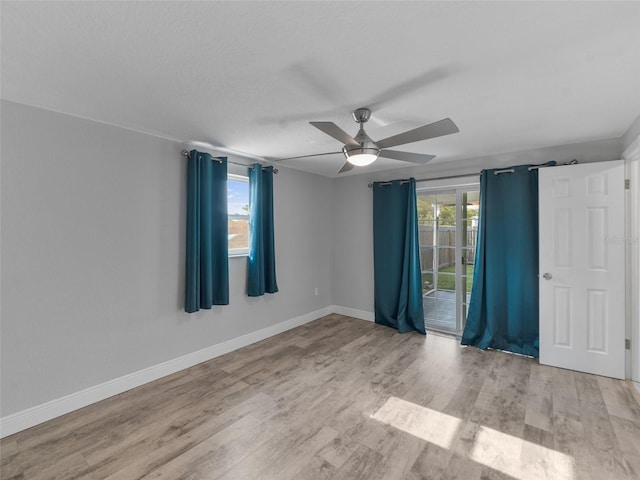 4238 Glissade Dr, New Port Richey, FL 34652 - unfurnished room featuring a ceiling fan, wood finished floors, and baseboards