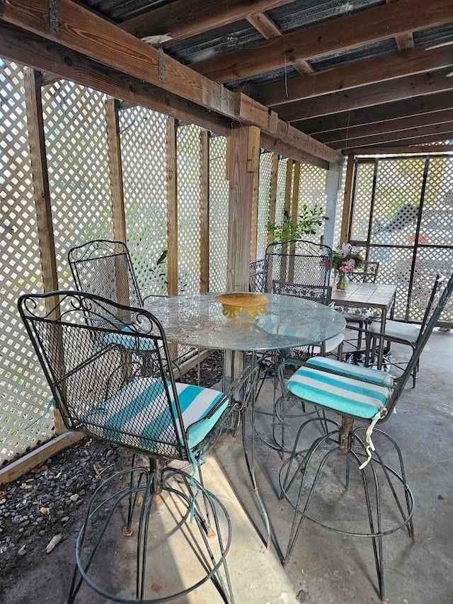 sunroom with outdoor dining space