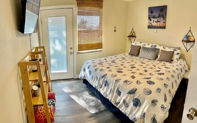 bedroom with wood finished floors