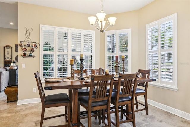 dining space with a chandelier, baseboards, light tile patterned floors, and recessed lighting