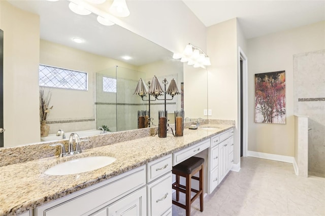 bathroom featuring a chandelier, a shower stall, double vanity, a garden tub, and baseboards