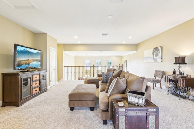 carpeted living room with baseboards and recessed lighting
