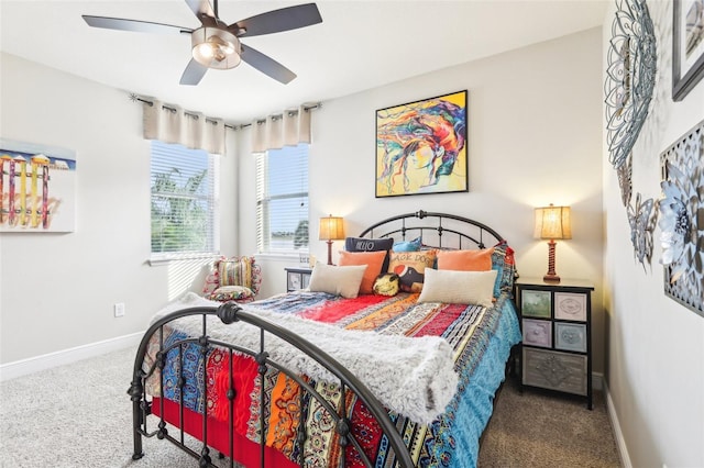 carpeted bedroom with baseboards and ceiling fan