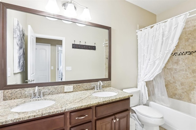 bathroom featuring toilet, shower / tub combo with curtain, and double vanity