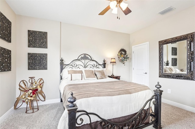 carpeted bedroom featuring baseboards and a ceiling fan