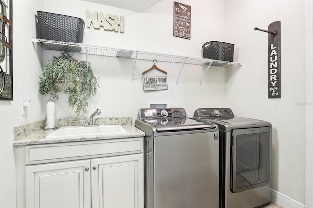 laundry room featuring washer and dryer and cabinet space