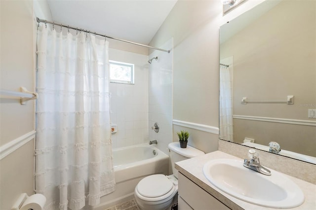 full bathroom with toilet, shower / tub combo with curtain, and vanity