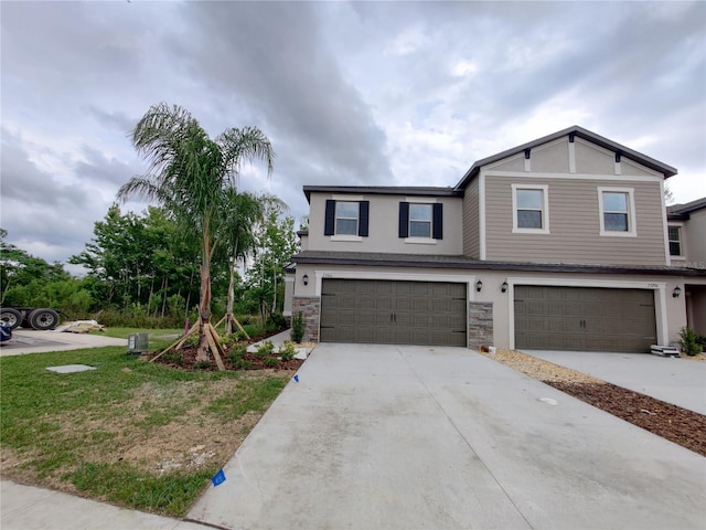 23300 Willow Glen Way, Lutz, FL 33549 - view of front facade with an attached garage, stucco siding, driveway, and stone siding
