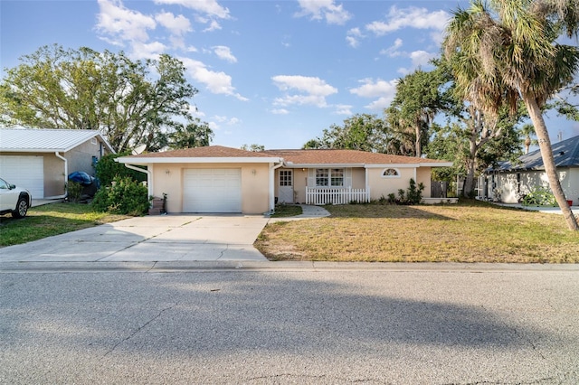 504 Casas Bonitas Dr, Nokomis, FL 34275 - ranch-style home featuring stucco siding, an attached garage, and concrete driveway