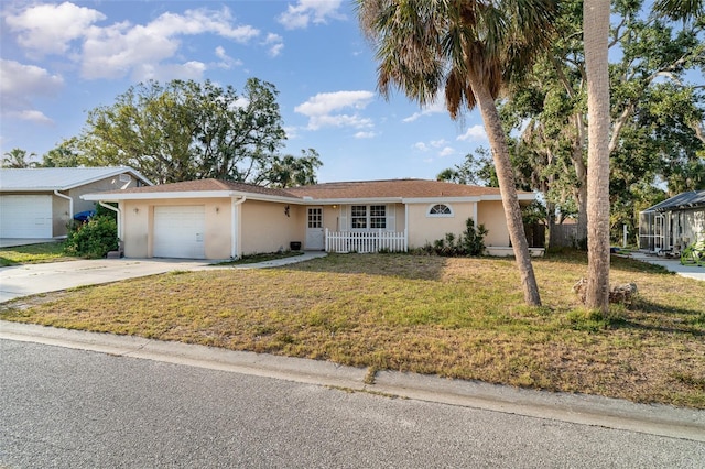 504 Casas Bonitas Dr, Nokomis, FL 34275 - single story home with stucco siding, an attached garage, driveway, and a front lawn