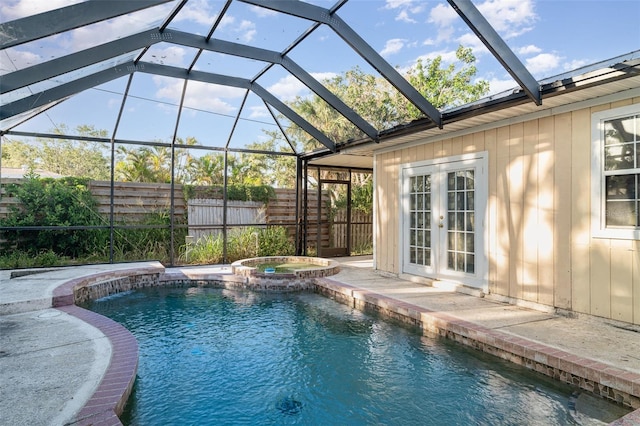 504 Casas Bonitas Dr, Nokomis, FL 34275 - view of pool featuring fence, a lanai, a pool with connected hot tub, and french doors