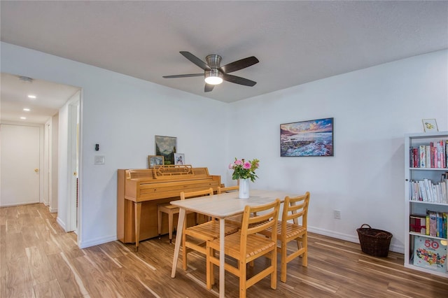 2870 Rampart Cir, Clearwater, FL 33761 - dining room with wood finished floors, a ceiling fan, and baseboards
