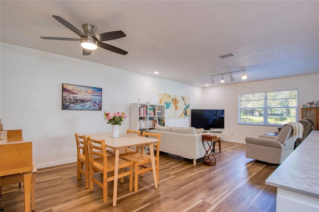 2870 Rampart Cir, Clearwater, FL 33761 - dining space with light wood-style flooring, baseboards, and ceiling fan