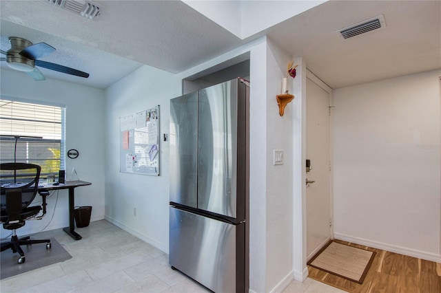 2870 Rampart Cir, Clearwater, FL 33761 - kitchen with freestanding refrigerator, a ceiling fan, baseboards, and a desk