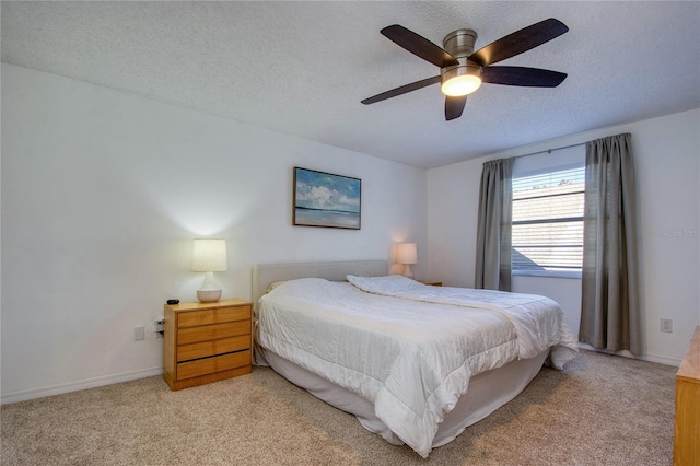 2870 Rampart Cir, Clearwater, FL 33761 - bedroom with light colored carpet, a textured ceiling, ceiling fan, and baseboards