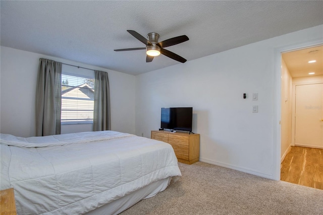 2870 Rampart Cir, Clearwater, FL 33761 - carpeted bedroom with ceiling fan, baseboards, and a textured ceiling