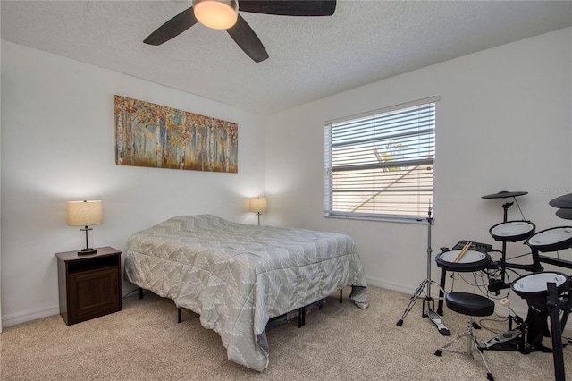2870 Rampart Cir, Clearwater, FL 33761 - bedroom featuring carpet flooring, a textured ceiling, a ceiling fan, and baseboards