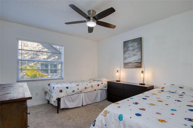 2870 Rampart Cir, Clearwater, FL 33761 - carpeted bedroom with a ceiling fan and baseboards