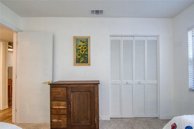2870 Rampart Cir, Clearwater, FL 33761 - carpeted bedroom with a closet and baseboards