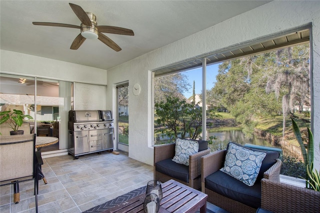 2870 Rampart Cir, Clearwater, FL 33761 - sunroom / solarium featuring a ceiling fan, outdoor lounge area, and a water view