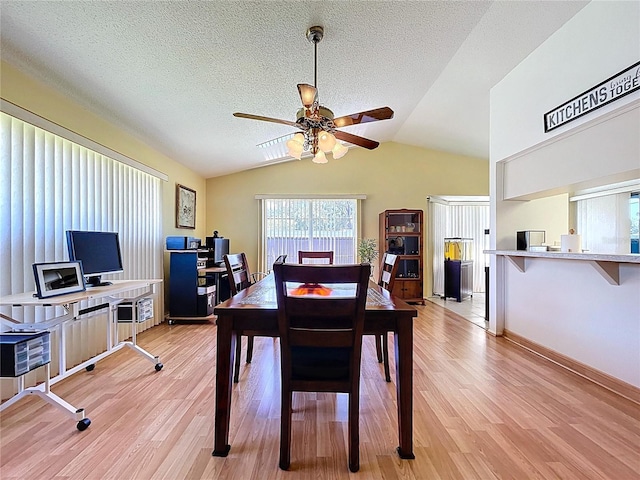 10520 Tapestry Dr, Port Richey, FL 34668 - dining area with ceiling fan, light wood-style floors, lofted ceiling, a textured ceiling, and an office area