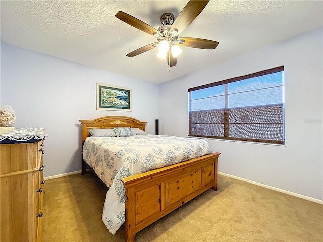 10520 Tapestry Dr, Port Richey, FL 34668 - bedroom with light carpet, a ceiling fan, and a textured ceiling