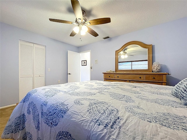 10520 Tapestry Dr, Port Richey, FL 34668 - bedroom featuring ceiling fan, a closet, and a textured ceiling