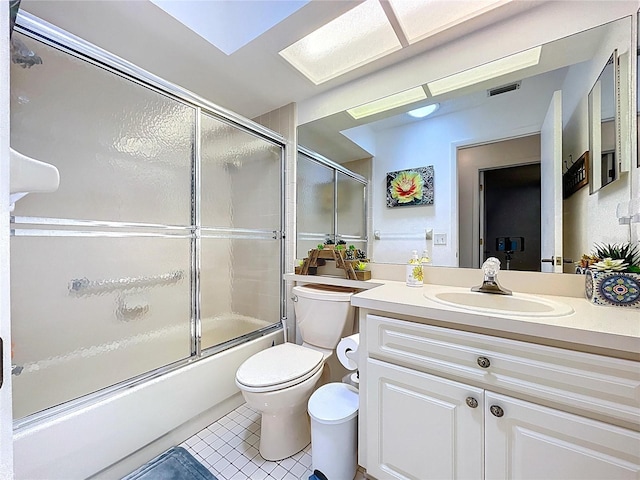 10520 Tapestry Dr, Port Richey, FL 34668 - bathroom featuring tile patterned floors, vanity, and enclosed tub / shower combo