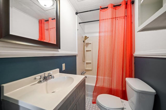 bathroom with toilet, vanity, and shower / bath combination with curtain