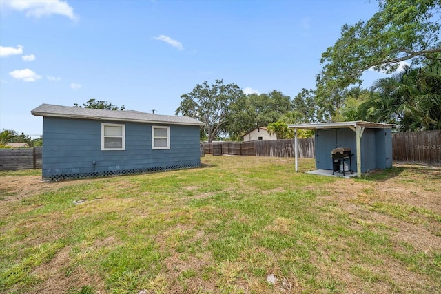 view of yard with a shed and an outdoor structure