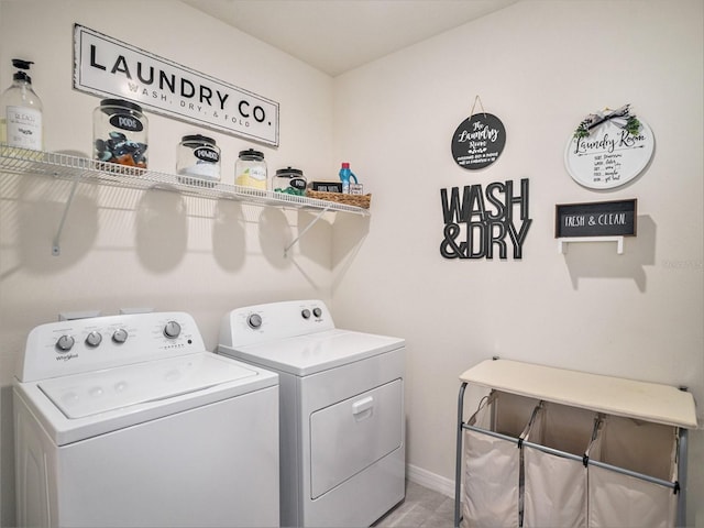17012 Oval Rum Dr, Wimauma, FL 33598 - washroom featuring washing machine and dryer and baseboards